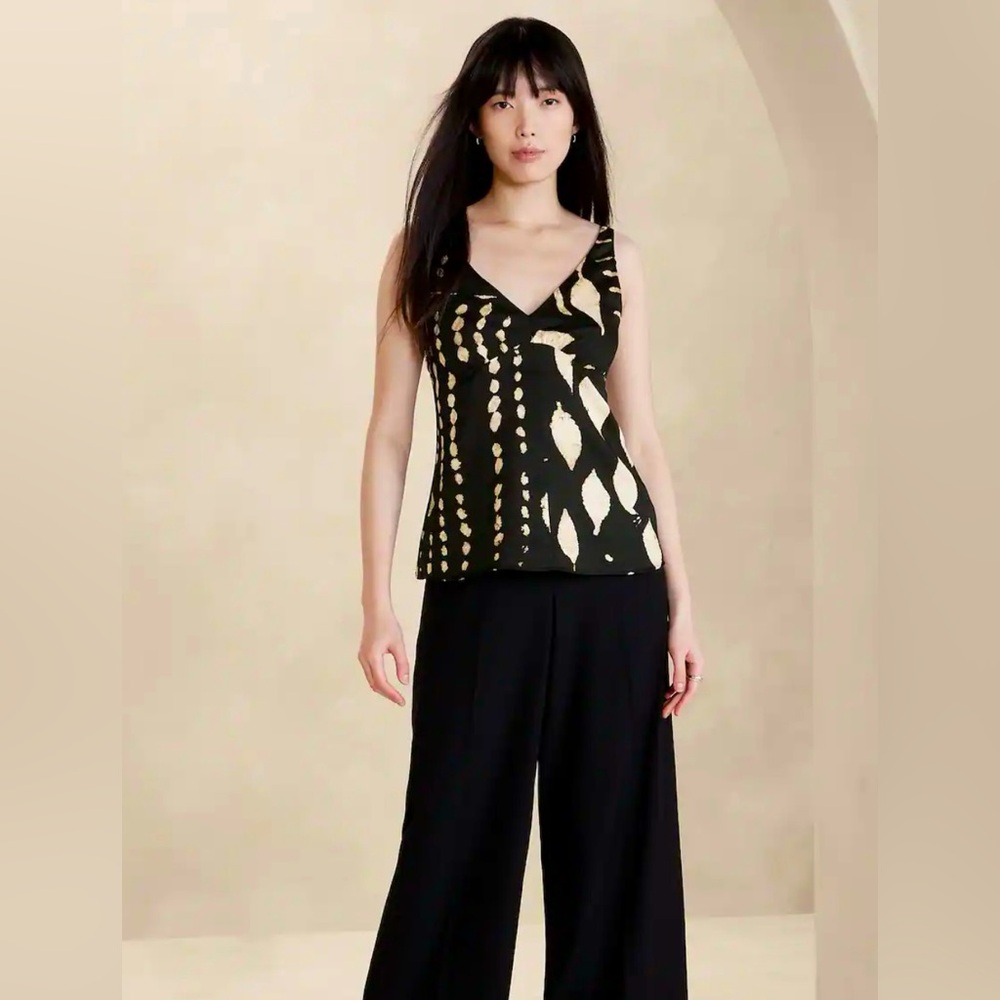 V-neck silky sheered tank top; sophisticated style to dress up or down.